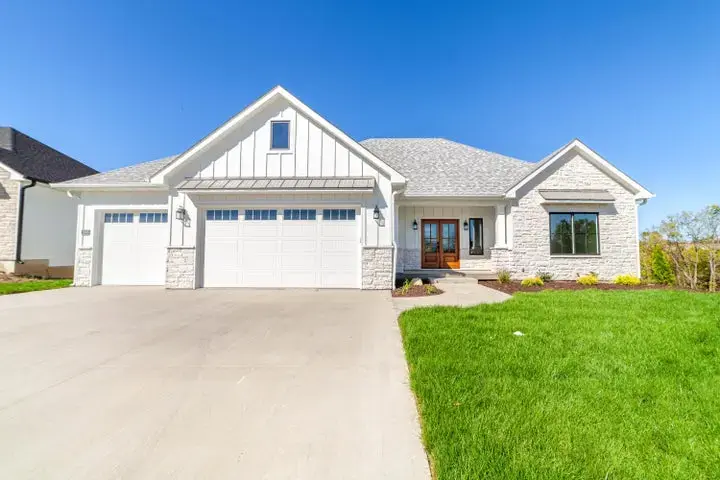 Image of Grey House with White Garage Doors
